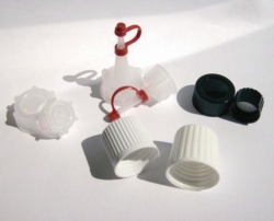 Moulded plastic caps, melamine, for square bottles series 310